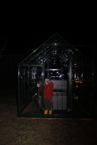 Toby inside the greenhouse at the end of our big build day