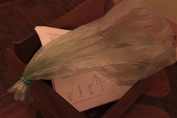 A balloon made from a thin plastic fruit bag and a bread clip