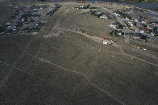 Old construction equipment and new houses along the top of "Little Badger Mountain"